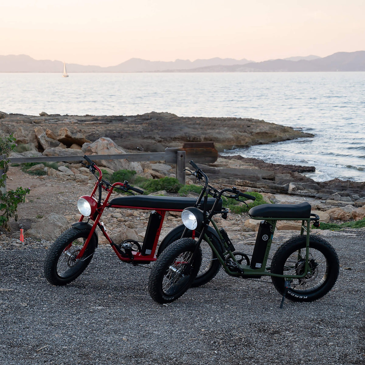 Two Unimoke e-bikes parked by the sea